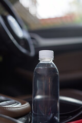Drinking water in the car prepared for traveling