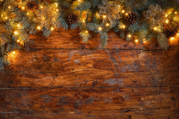 A festive Christmas garland on a rustic wooden backdrop