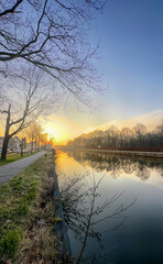 A stunning sunset view of a winding river that showcases the landscapes natural beauty and peaceful vibes