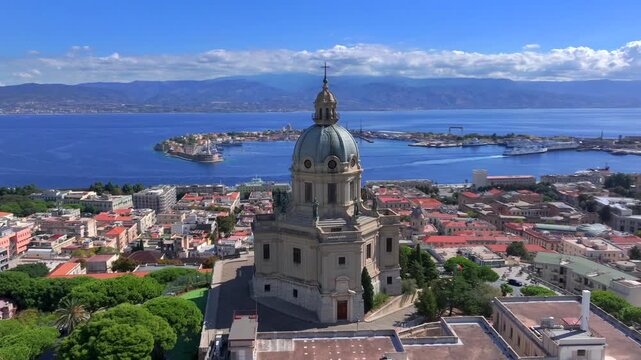 Aerial Drone View over Messina, Sicily, Italy. Tempio di Cristo Re Temple on a Hill over the Harbour on Sunny Day.