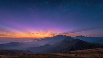 Obraz premium Sunrise over misty mountains with stars in the purple sky