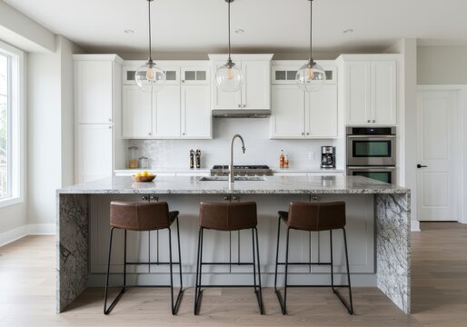 Contemporary kitchen features white cabinetry surrounding a large island with stone waterfall sides and three bar stools