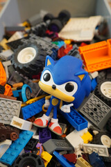 Naklejka premium Sonic the Hedgehog Funko Pop figure surrounded by colorful toy bricks