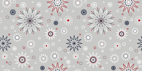Christmas seamless pattern with snowflakes. Winter background classic style in traditional colors. Snowfall on grey background. Christmas mood pattern