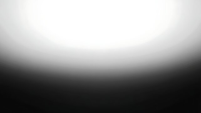 Abstract black and white gradient background with soft transition from dark to light