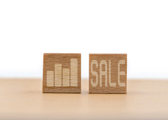 Wooden Blocks With Bar Chart And SALE Text Symbolize Growth, Marketing And Sale Event