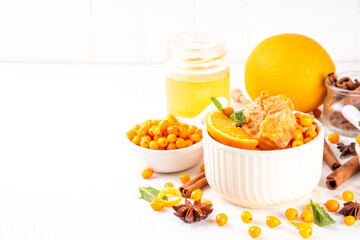 Tasty autumn sea buckthorn ice cream, sweet and sour hippophae gelato or sorbet with orange zest, honey and spices