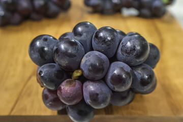 Bunch of dark blue grapes. Fresh Concord grapes, Healthy fruits.