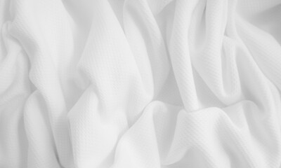 Obraz premium Close-up wavy cloth. White crumpled fabric background