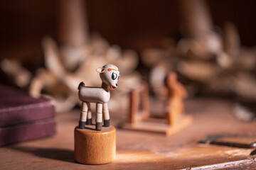 An old wooden children's' toy in an antique cabinet