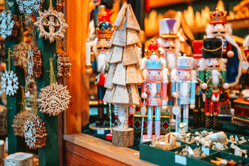 Wooden Christmas tree and nutcrackers ornaments for holiday decoration display detail.