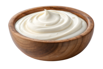 Creamy white frosting swirled in a wooden bowl isolated on transparent background