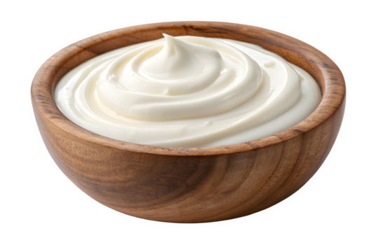 Creamy white frosting swirled in a wooden bowl isolated on transparent background