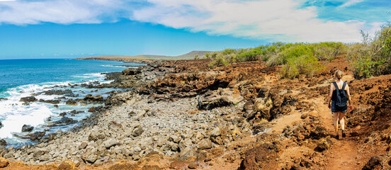 Female Hiker on Volcanic Landscape of Pohakumauliuli Beach, Molokai, Hawaii, USA