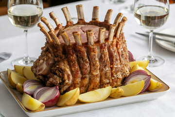 Cinematic Highly Detailed Ultra High Resolution Photograph of a Crown Roast of Lamb or Pork Served with Roasted Potatoes