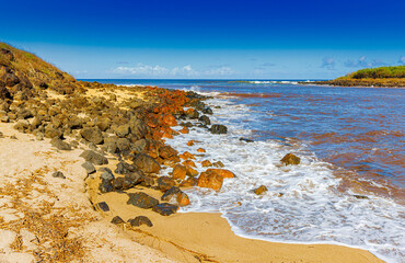 Red Waves Caused By Red Dirt on Dixie Maru Beach, Molokai, Hawaii, USA