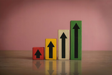 A Minimalist Business Growth Chart Made of Colored Wooden Blocks Showing an Upward Trend