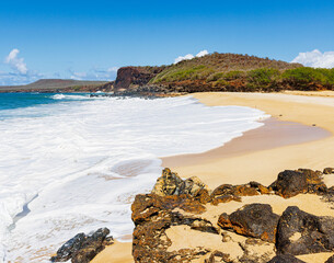 Volcanic Rock and White Sand With Black Rock Cinder Cone on Pohakumauliuli Beach, Molokai, Hawaii, USA