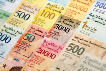 Obraz premium Venezuelan Bolivar currency money bills in big amount. Heap of VED currency banknotes with different denomination close up