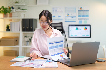 Confident businesswoman showing data charts and financial report during online meeting.