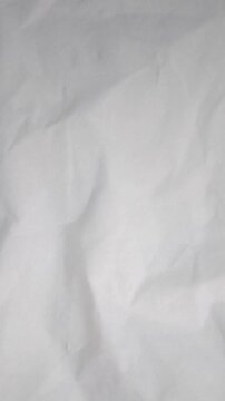 animation of white paper crumpled motion video background, paper crumpled vertical motion video.