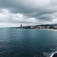 Naklejka premium Coastal Cityscape Under Cloudy Skies - A Serene Ocean View.