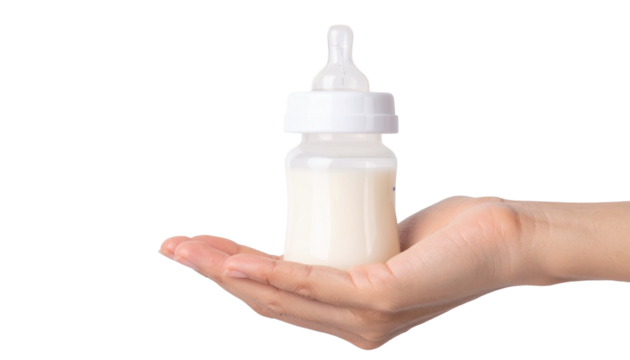 A hand holding a baby bottle filled with milk, a symbol of care and nourishment
