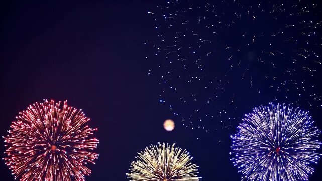 beautiful 4k loop animation colorful fireworks bursting dark blue night sky central space logo message perfect festive celebrations new year holiday greetings