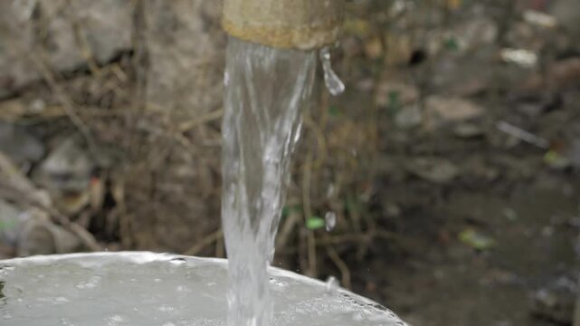 Unleashing the Power of Water - A Close-Up Look at a Hand Pump in Action