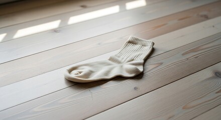Single Sock on Wooden Floor