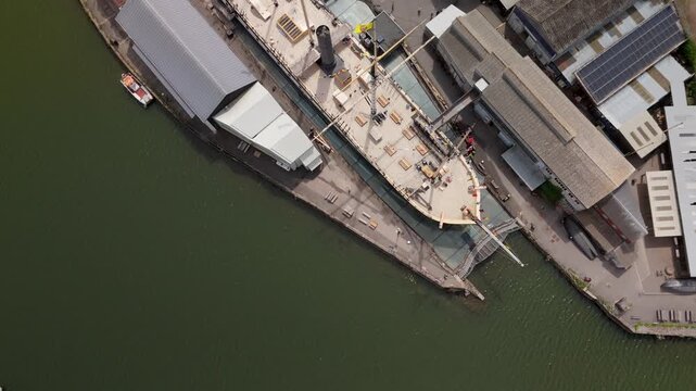 Bristol England: 28th July 2025: Drone view of Brunel's SS Great Britain rests at the dock in Bristol. Topdown drone footage