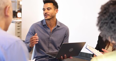 Young businessman leading a creative team brainstorming session - Powered by Adobe