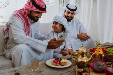 Arab family bonding, father and son relaxing