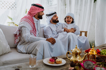 Arab family bonding, father and son relaxing