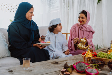 Muslim family members celebrating eid or ramadan holiday
