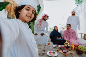 Middle eastern family in traditional attire sitting together