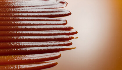 Tomato sauce in abstract form creates smooth artistic pattern with rich red color and glossy texture on reflective surface