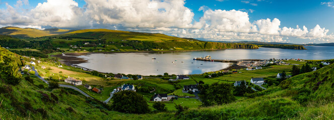 Isle of Skye, Scotland, Uk: aerial view of the sheltered bay of Uig (Snizort) on the northern coast of the Trotternish peninsula, with the port and the ferries departing for the Outer Hebrides