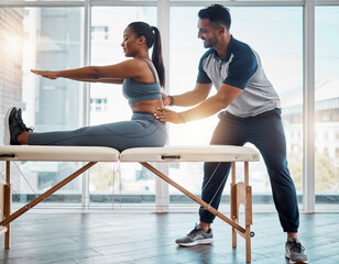 Physiotherapist doing exercise with patient