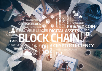 A diverse team shares ideas about blockchain technology in a modern office, highlighting key terms related to cryptocurrency and digital assets. Collaboration drives innovation. Tessel