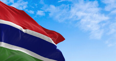 National flag of the Gambia waving in the wind on a clear day