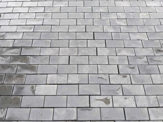 Abstract background. New cobblestone pavement closeup