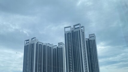 Fototapeta premium Hong Kong city skyline with modern skyscrapers and blue sky