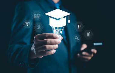 Businessman holding light bulb with e-learning icon and digital education symbols, representing online learning, innovation, and modern technology in knowledge development.