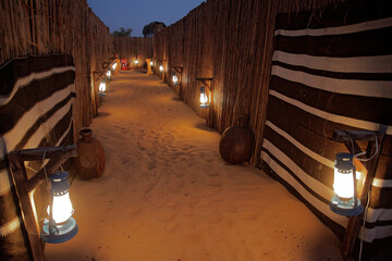 Arabian traditional tent in the middle of the desert for a family gathering in Dubai, United Arab Emirates, with Arab heritage.