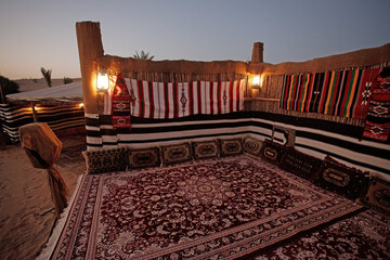 Arabian traditional tent in the middle of the desert for a family gathering in Dubai, United Arab Emirates, with Arab heritage.