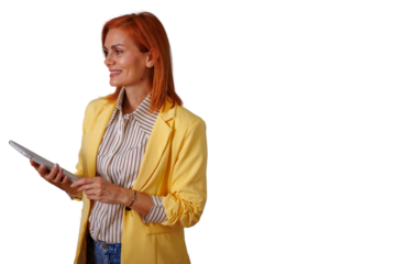 Businesswoman with red hair and yellow blazer holding tablet, confidently smiling and looking away on transparent background