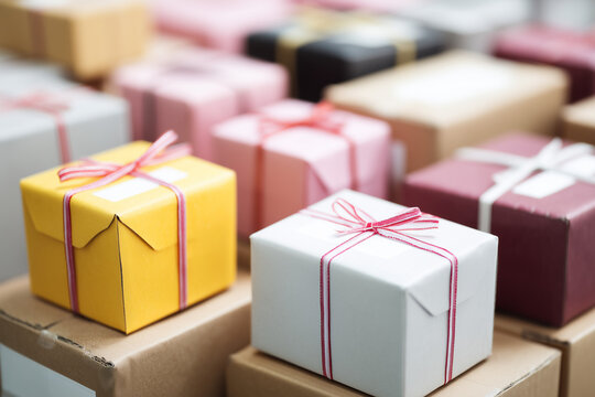 Holiday delivery concept, packaged boxes with ribbons ready to ship, e-commerce logistics - Powered by Adobe