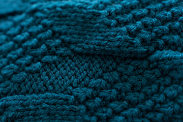 Detailed blue Wool Knit Sweater Texture. A close-up of a wool knit sweater