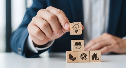 Businessman stacking blocks with ecofriendly icons